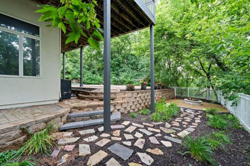 The newly updated patio area includes a cozy outdoor firepit area creating a resort-like atmosphere right at home.