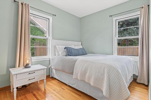 The guest bedroom has a large closet and has been freshly painted