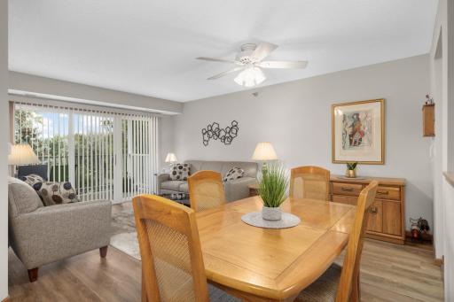 Positioned between the kitchen and living room, the dining area is filled with natural light and perfect for everyday meals or special occasions