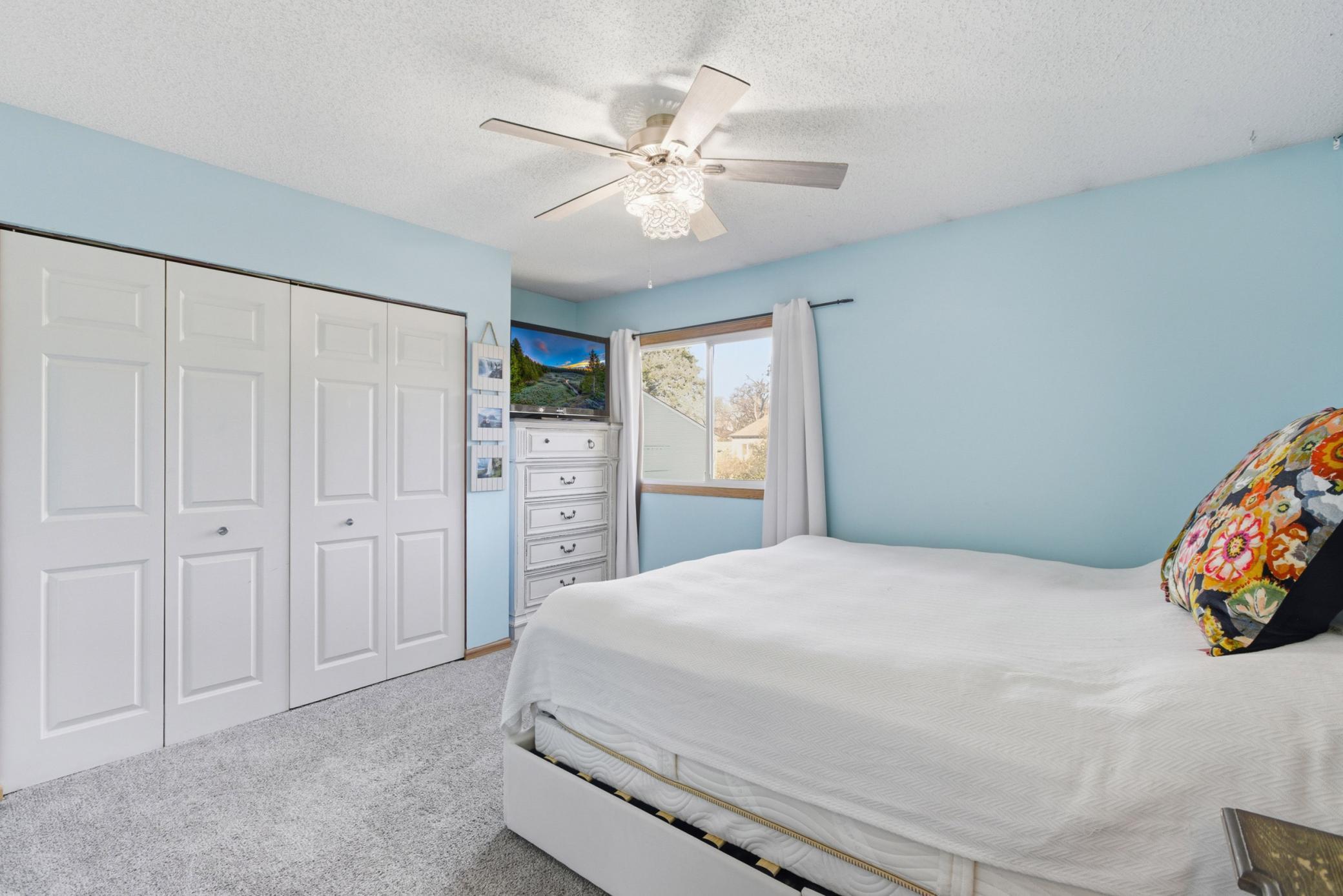 One of the three bedrooms located on the upper level