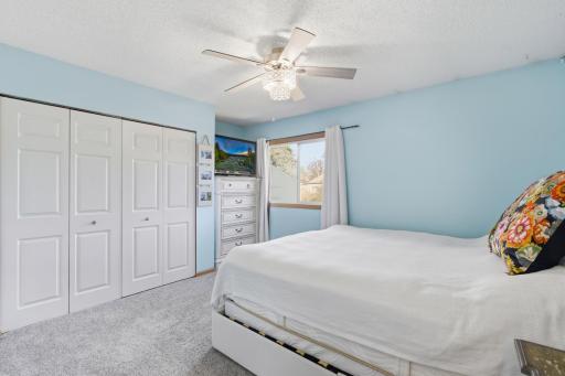 One of the three bedrooms located on the upper level