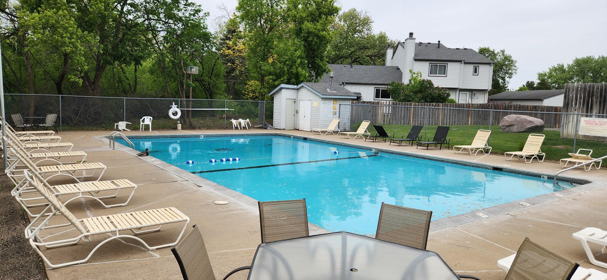 Relax in the sun around the in-ground heated pool.