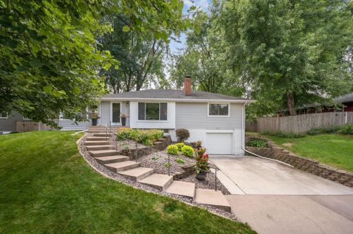 Welcome home to 8501 Meadow Lake Place in New Hope! Beautiful landscaping updated in 2020, new 3/4 concrete driveway in 2021, new garage door in 2017, and new bottom retaining wall in 2015.