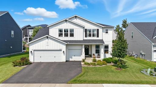 Striking 2021-built home with modern farmhouse style and a beautifully landscaped yard.