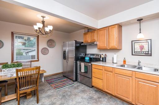 Updated kitchen with stainless appliances and updated lighting.