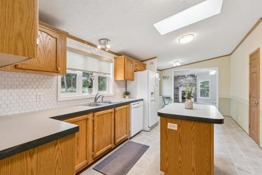 Sunlight streams through the skylight, casting natural light throughout the kitchen!
