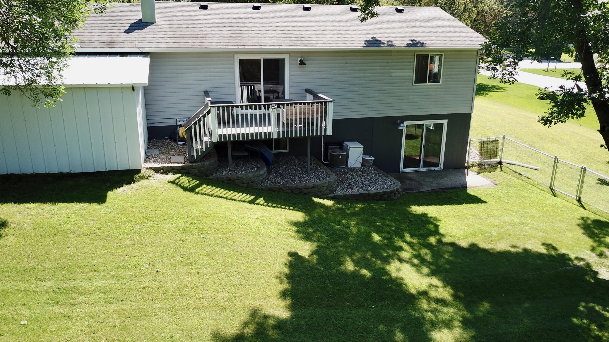 Rear with fenced yard with walk out