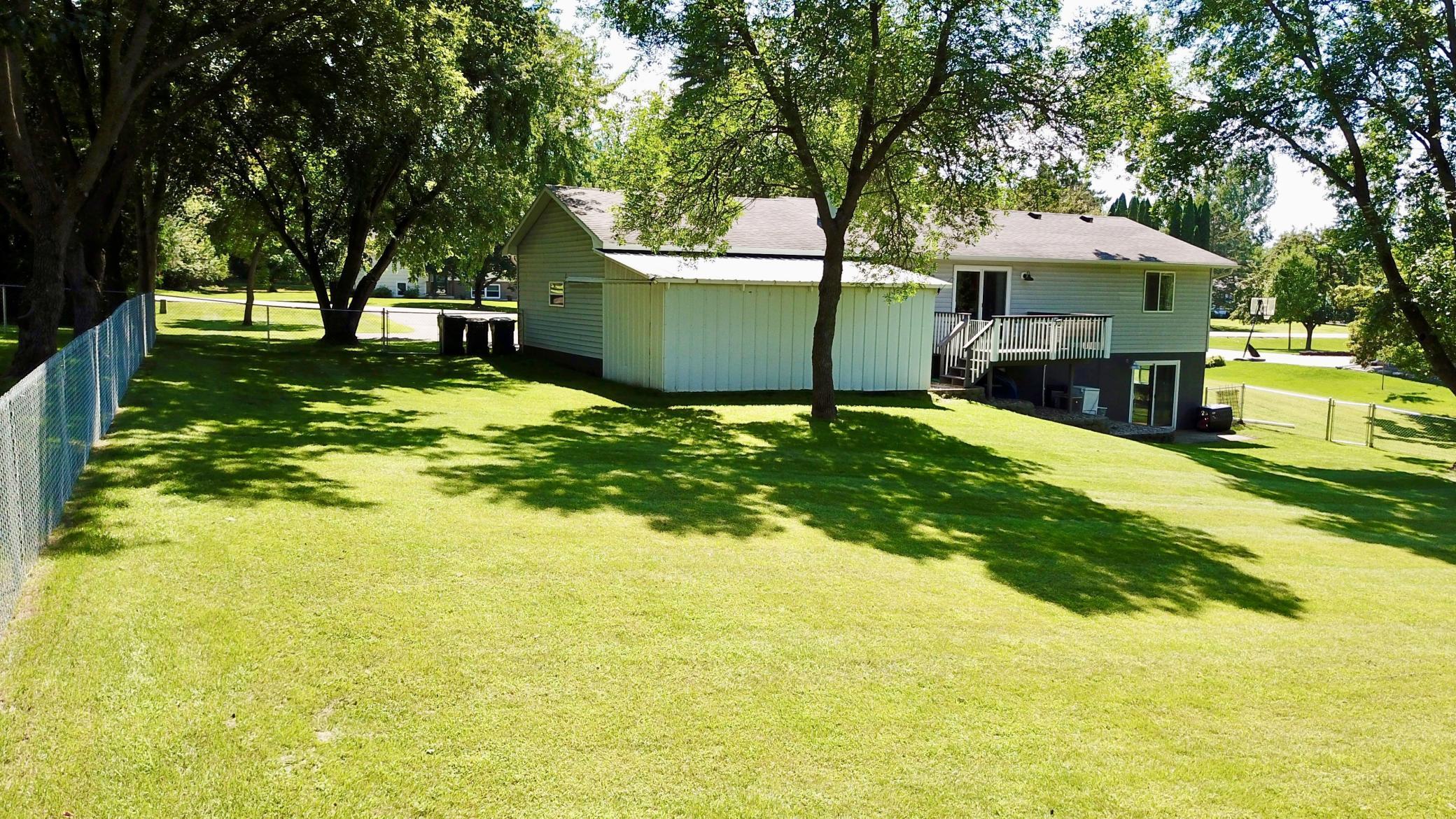 Rear with fenced yard & lean to