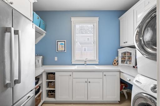 Laundry Room with Extra Refrigerator and Cabinetry