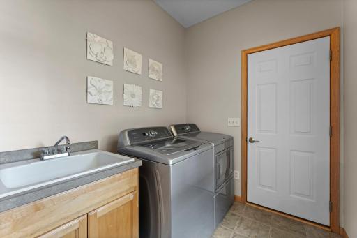 The laundry room offers access to the garage and doubles as a mud room.