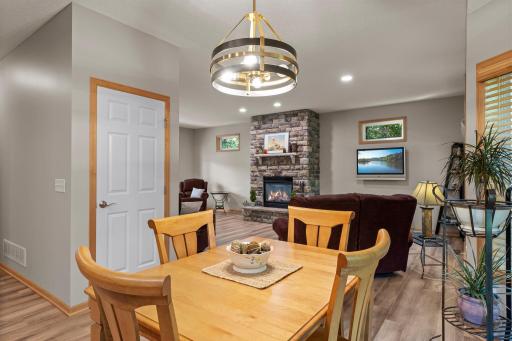 The dining room overlooks the wooded backyard.