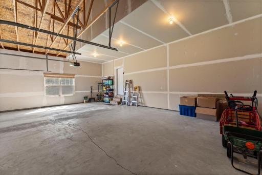 The three car garage offers plenty of space for parking, working on projects, or extra storage.