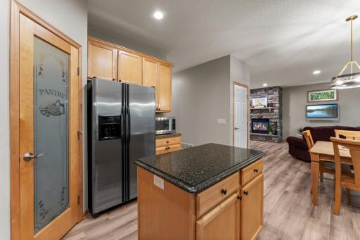 The kitchen features beautiful natural woodwork and stainless steel appliances.
