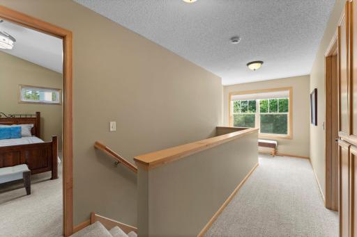 The upper level includes 3 bedrooms and a full bathroom.