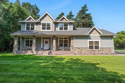 This gorgeous home features a full length covered front porch.