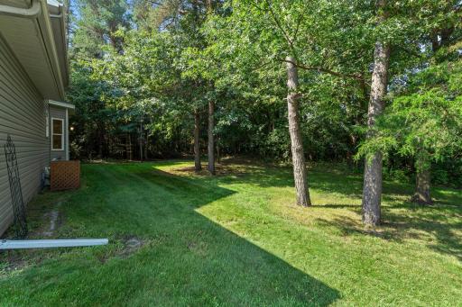 The heavily wooded lot offers both shade and privacy.