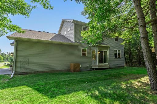 The heavily wooded lot offers both shade and privacy.