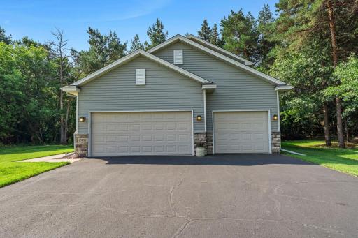 This home features an asphalt driveway and a 3-car garage.