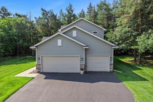 This home features an asphalt driveway and a 3-car garage.