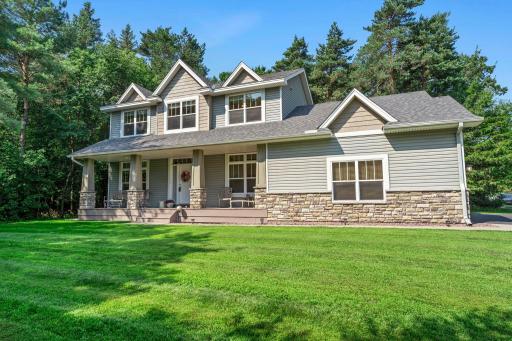 This gorgeous home features a full length covered front porch.