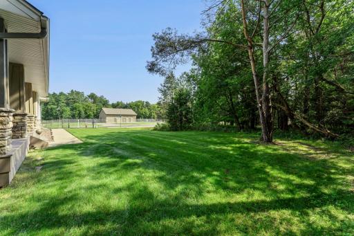 The heavily wooded lot offers both shade and privacy.
