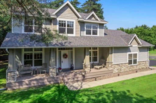 This gorgeous home features a full length covered front porch.