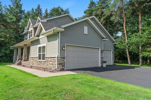 This home features an asphalt driveway and a 3-car garage.