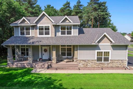 This gorgeous home features a full length covered front porch.