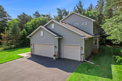 This home features an asphalt driveway and a 3-car garage.