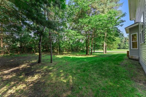 The heavily wooded lot offers both shade and privacy.