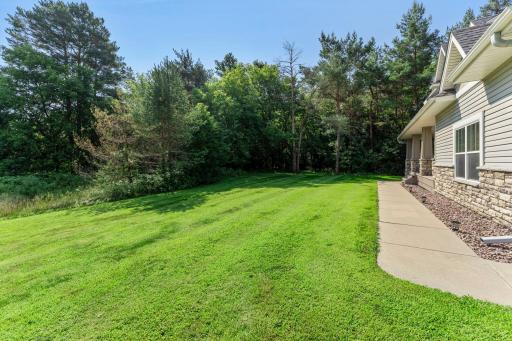 The heavily wooded lot offers both shade and privacy.
