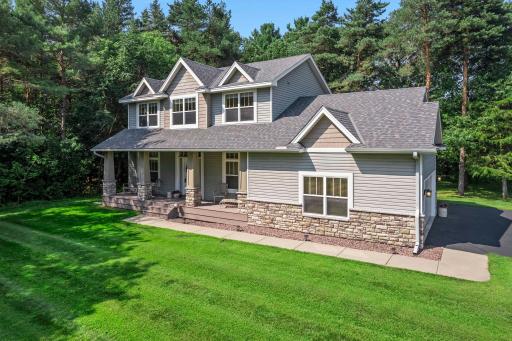 This gorgeous home features a full length covered front porch.