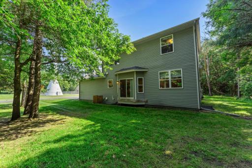 The heavily wooded lot offers both shade and privacy.