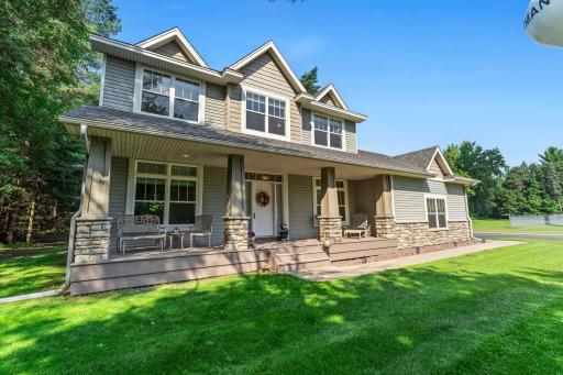 This gorgeous home features a full length covered front porch.