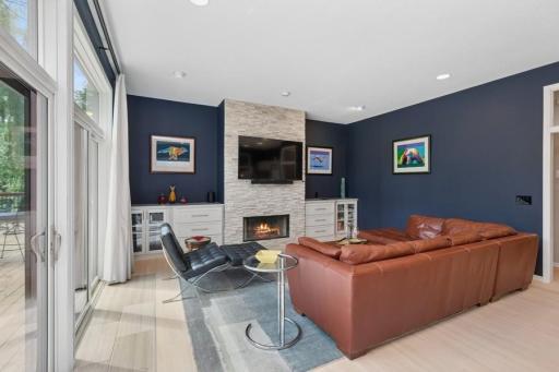 Floor to ceiling stone surround fireplace
