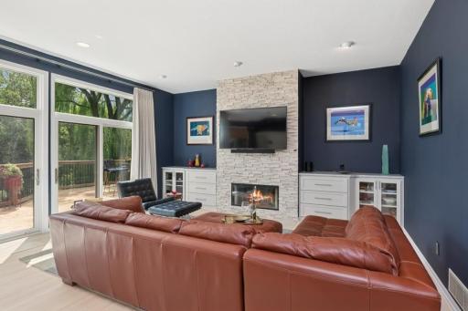Fireplace flanked by two built in cabinets - great for media or displaying treasured decor