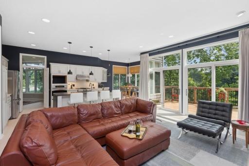 Two sets of sliding glass doors capture the view