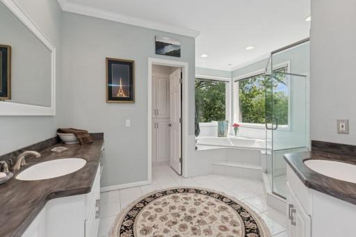 Two vanities, separate shower and jetted tub and water closet