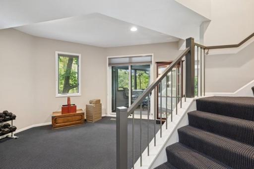 Head downstairs to flex room and three season porch