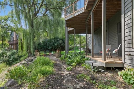 Lower deck steps down to paver patio and firepit