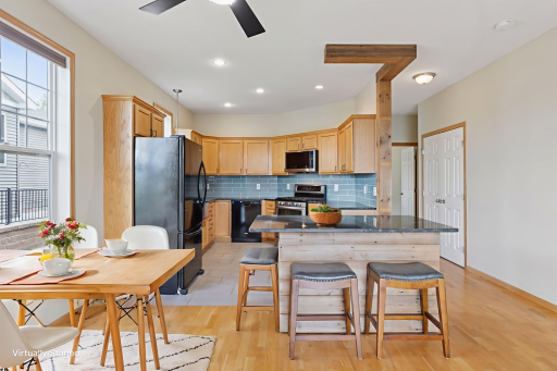 Fantastic updated kitchen with island and bar stools and space for a dining table!