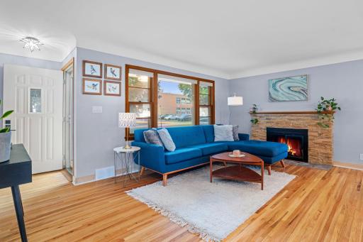 large picture window in living room + fireplace
