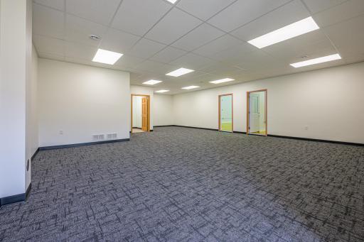 Step into the spacious lobby featuring new carpet and fresh paint.