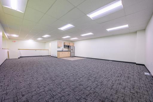 The mezzanine has a kitchenette and could be used for office, hosting groups/ parties, or other fitness concepts.