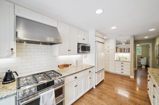 Coffee Nook with Storage and Hallway Leading to Walk-in Pantry and Powder Room