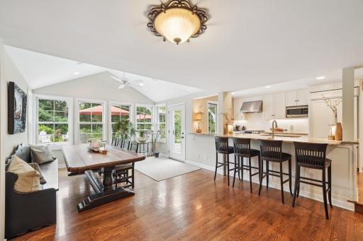 Counter Seating and an Open Kitchen to Dining and Family Rooms