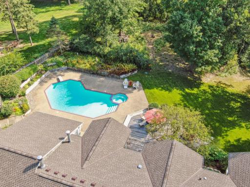 Beautiful Pool and Spa Surrounded by Patio and Perennial Gardens