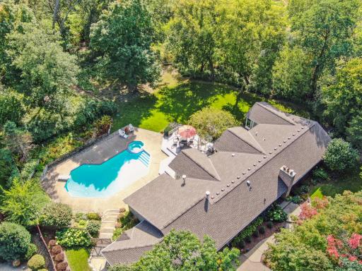 Professional Landscaping with Perennial Gardens Surround this Home