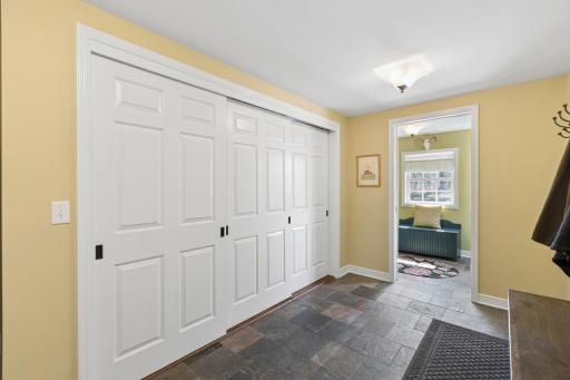 Large Mudroom with Ample Closets and Pool Storage Room with Access to Pool Area