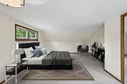 Upper level primary bedroom - virtually staged